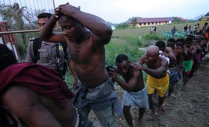 Apartheid in West Papua. Civilians are led away like slaves after being detained following a peaceful meeting in 2011