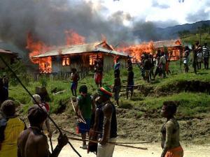 Papuans return to find their homes in burnt to the ground by the Indonesian army following a 'sweeping operation'